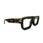 Shari Dionne Michael Corleone Eyewear with clear lens and black and gold frame side view