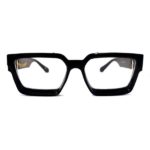Shari Dionne Michael Corleone Eyewear with clear lens and black and gold frame