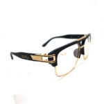 Side view of oversized blue light glasses with black and gold frame. Name the Larry Hover glasses for there larger than life stye